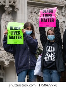 UK, London, 6/6/2020 - Two caucasian children holding Black Lives Matter placards on Parliament Square, London, UK at a Black Lives Matter Protest 