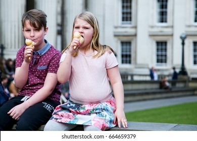 UK, London - April 08, 2015: Children eat ice cream