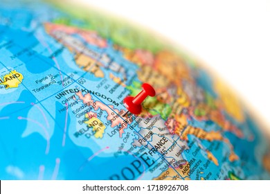 UK Map. Earth Globe Close Up With A Red Pin In United Kingdom.