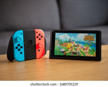 UK, March 2020: Nintendo Switch Joy Con Grip With Animal Crossing New Horizons Game