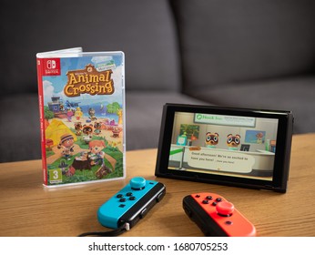 UK, March 2020: Nintendo Switch With Joy Con Controllers And New Animal Crossing New Horizons