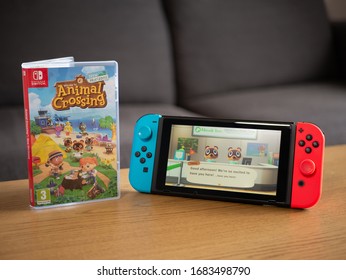 UK, March 2020: Nintendo Switch With Animal Crossing New Horizons Game On Screen