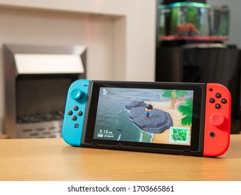 UK, March 2020: Nintendo Switch Games Console Animal Crossing New Horizons Fishing