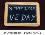 UK may bank holiday moved from 4 to 8 May 2020 to celebrate 75 years of end of WWII VE Day on old fashioned school writing slate.