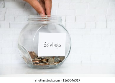 UK Money Jar On A White Shelf In A Household Living Room. Currency Saving Concept