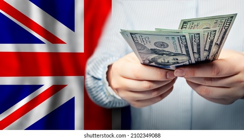 UK National Flag And US Dollars Banknote. Business, Finance, Politics And Corruption Concept