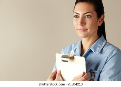 UK Nurse Holding Clipboard