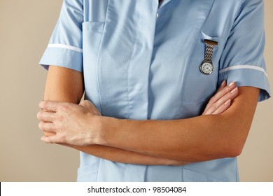 UK Nurse Standing With Arms Folded