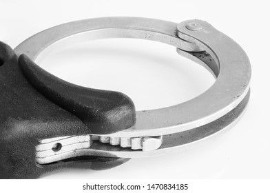 UK Police Handcuffs In Black And White.