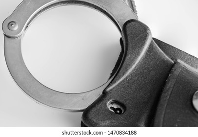 UK Police Handcuffs In Black And White.