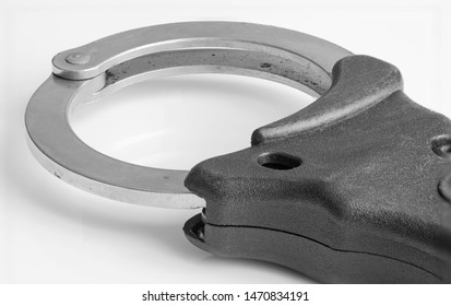 UK Police Handcuffs In Black And White.