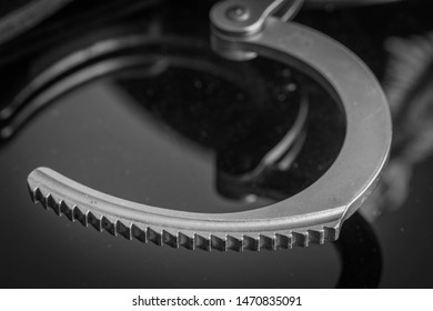 UK Police Handcuffs In Black And White.