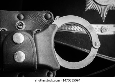 UK Police Handcuffs In Black And White.