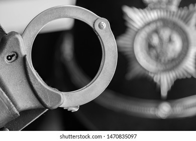 UK Police Handcuffs In Black And White.