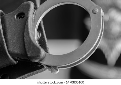 UK Police Handcuffs In Black And White.