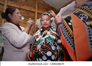 Ukhrul, Manipur / India - January 4 2017: A Tangkhul Naga Bride Being Dressed Up By Her Mother In Traditional Tangkhul Ornaments For Her Wedding (send Off Ceremony)