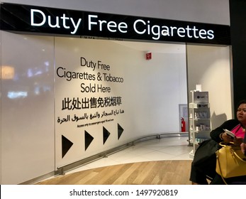 ‍London, UK/July 7,2019: The Sign Of Duty Free Cigarettes In Heathrow Airport.