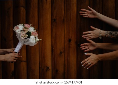 Ukraine, Bila Tserkva, 20.07.2019: 
Bridesmaids Reach For A Bouquet, The Idea Of ​​wedding Photos. Film And Grain Photo