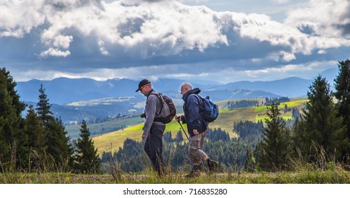 ukraine, carpathian, 15.09.17: trekking in the mountains. mountain tourism. two men go to the mountains - Shutterstock ID 716835280
