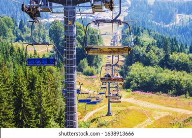 Ukraine, Carpathians, Bukovel. August 2019. The people on the lift ascend to the mountain top