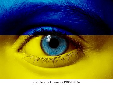 ukraine crisis concept child face in ukraine flag colors