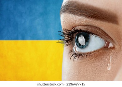 Ukraine crisis concept. Eye, crying with a tear running down her cheek