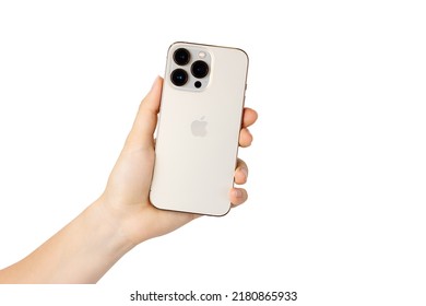 UKRAINE, DNEPR - JULY 14, 2022: smartphone Apple Iphone 13 Pro. A hand holds an iPhone 13 pro on a white background. Iphone 13 pro back view isolated on white.