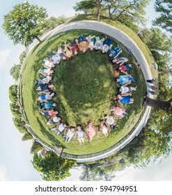 Ukraine, Dnipro, May 20, 2015: A Lot Of People Laying On The Grass In Circle Top View