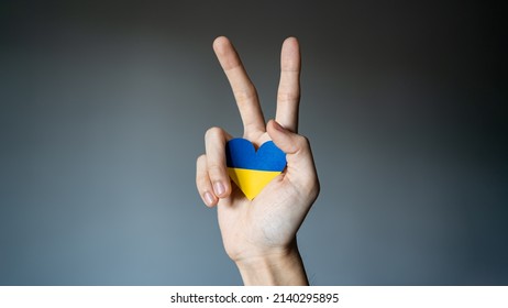 Ukraine Flag Color Heart In Hand Making V Sign