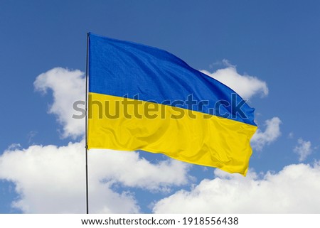 Ukraine flag isolated on the blue sky with clipping path. close up waving flag of Ukraine. flag symbols of Ukraine.