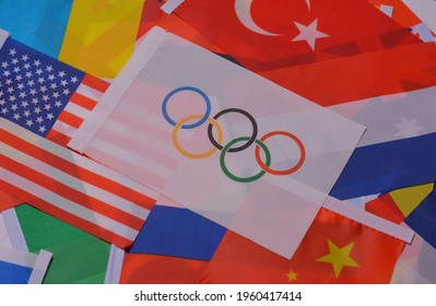 Ukraine, Kharkov, 2021, April 16. Olympic flag against the background of flags of the countries of the world. Olympic Games Tokyo 2020.