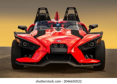 Ukraine, Kiev - August 20, 2017: Unique red tricycle Polaris Slingshot SL on a clean background. Wallpaper. For advertising