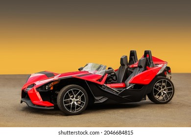 Ukraine, Kiev - August 20, 2017: Unique red tricycle Polaris Slingshot SL on a clean background. Wallpaper. For advertising