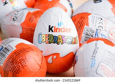 Ukraine, Kiev - December 25, 2018: Kinder Surprise Egg Stands Between Many Other Eggs. Chocolate Egg Is A Sweet Present By Italian Confectionery Manufacturer Ferrero SpA.