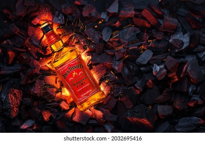 Ukraine, Kiev. November 12, 2020. Bottle Of Jack Daniels Whiskey Tennessee Fire Top View In Burning Coals.