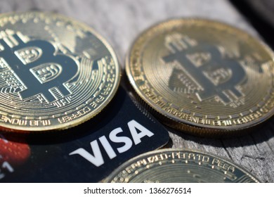 Ukraine, Kremenchug - March, 2019 Golden Bitcoins On Visa Card