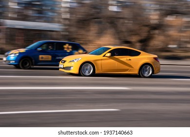 Ukraine, Kyiv - 11 March 2021: Yellow Hyundai Genesis Car Moving On The Street;