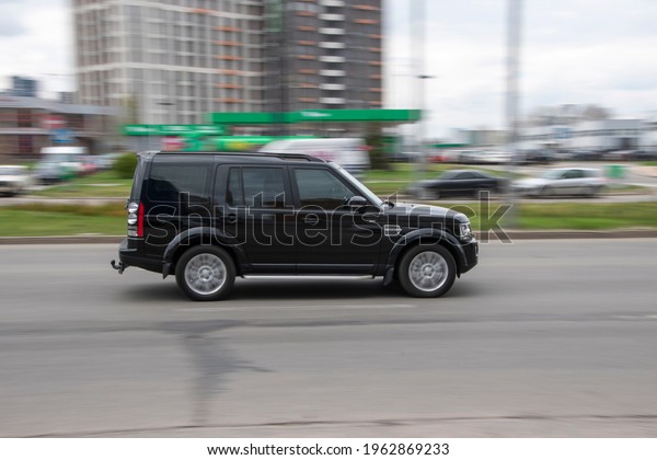 Ukraine, Kyiv - 20 April 2021: Black\
Land Rover Discovery car moving on the street.\
Editorial