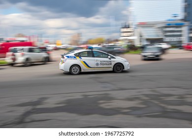 Ukraine, Kyiv - 26 April 2021: White Toyota Prius Car Moving On The Street. Editorial