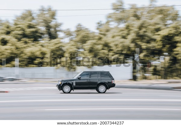 Ukraine, Kyiv - 27 June 2021: Black\
Land Rover Range Rover car moving on the street.\
Editorial