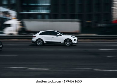 Ukraine, Kyiv - 29 April 2021: White Porsche Macan car moving on the street. Editorial