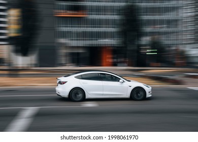 Ukraine, Kyiv - 29 April 2021: White TESLA Model 3 Car Moving On The Street. Editorial