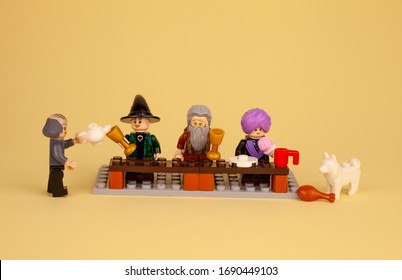 Ukraine, Kyiv - April 1, 2020: Lego Men And Figures From The Harry Potter Drink Tea, Dine, Eat. Lego Constructor And Its Details. Child Game. Place For Text. Isolated Plot. Holiday, Feast.Food At Home