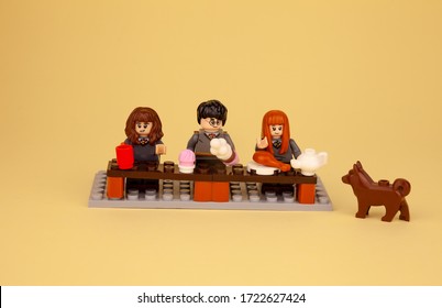 Ukraine, Kyiv - April 1, 2020: Lego Men And Figures From The Harry Potter Drink Tea, Dine, Eat. Lego Constructor And Its Details. Child Game. Place For Text. Isolated Plot. Holiday, Feast.Food At Home