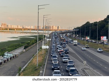 Ukraine, Kyiv - August 03. 2021. Traffic Jam In The City Of Kyiv. Traffic Jam On The Road In The City Near The River Of The Dnipro.