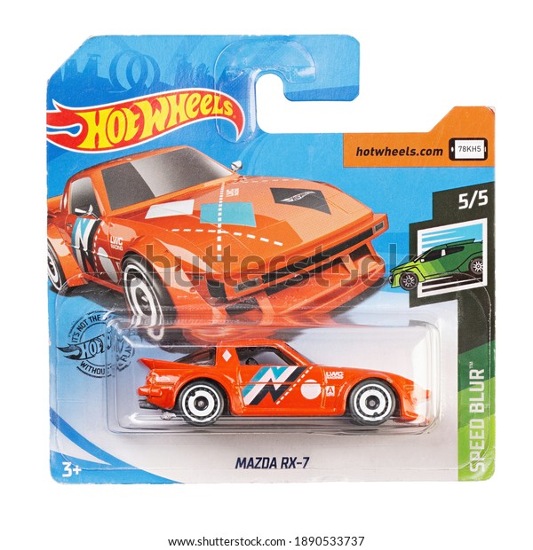 Ukraine, Kyiv - December 26. 2020: Hot wheels toy\
car Mazda RX-7 close up picture. Hot Wheels is a scale die-cast toy\
cars by American toy maker Mattel in 1968. File contains clipping\
path.