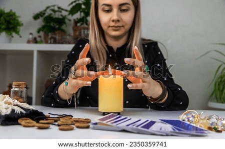 UKRAINE, KYIV - JANUARY 8, 2023. Fortune teller woman reads fortunes on tarot cards. Selective focus.