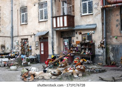 Ukraine, Lviv - 01 March 2020: Yard of lost toys. Lot of abandoned old toy near house - Shutterstock ID 1719176728