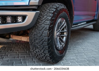 Ukraine, Odessa July 8 - 2021: New Ford Ranger Raptor Blue Color On The Parking. Focus On The Front Wheel. Body Detail Of The Car