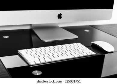 UKRAINE, RIVNE, NOVEMBER 2, 2016. Apple Computer IMac 27 Retina Display 5K Keyboard And Magic Mouse On Black Table. Isolated On A White Background